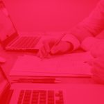 person working on laptop with red overlay